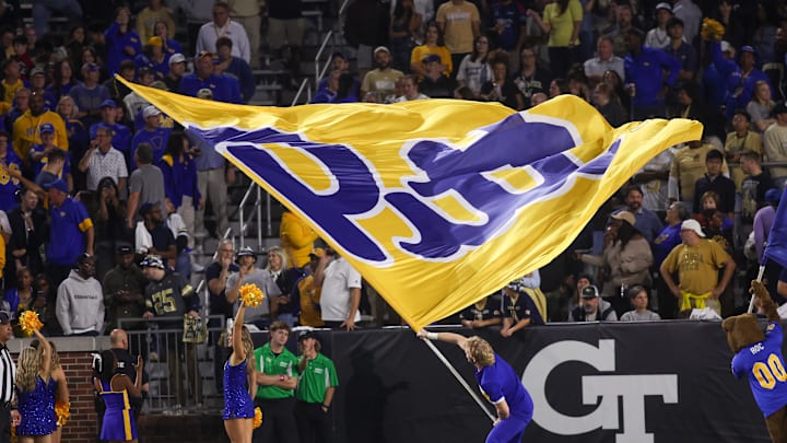 Nov 22, 2025; Atlanta, Georgia, USA; Pittsburgh Panthers cheerleader waves a flag after a touchdown against the Georgia Tech Yellow Jackets in the fourth quarter at Bobby Dodd Stadium at Hyundai Field. Mandatory Credit: Brett Davis-Imagn Images Nov 22, 2025; Atlanta, Georgia, USA; Pittsburgh Panthers cheerleader waves a flag after a touchdown against the Georgia Tech Yellow Jackets in the fourth quarter at Bobby Dodd Stadium at Hyundai Field. Mandatory Credit: Brett Davis-Imagn Images