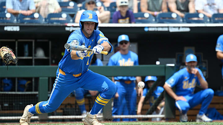 Jun 14, 2025; Omaha, Neb, USA; UCLA Bruins shortstop Roch Cholowsky (1) bunts in a run against the Murray State Racers during the fourth inning at Charles Schwab Field. Mandatory Credit: Steven Branscombe-Imagn Images Jun 14, 2025; Omaha, Neb, USA; UCLA Bruins shortstop Roch Cholowsky (1) bunts in a run against the Murray State Racers during the fourth inning at Charles Schwab Field. Mandatory Credit: Steven Branscombe-Imagn Images