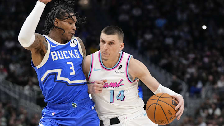 Feb 23, 2025; Milwaukee, Wisconsin, USA; Miami Heat guard Tyler Herro (14) dribbles the ball under pressure from Milwaukee Bucks guard Kevin Porter Jr. (3) during the fourth quarter at Fiserv Forum. Mandatory Credit: Jeff Hanisch-Imagn Images Feb 23, 2025; Milwaukee, Wisconsin, USA; Miami Heat guard Tyler Herro (14) dribbles the ball under pressure from Milwaukee Bucks guard Kevin Porter Jr. (3) during the fourth quarter at Fiserv Forum. Mandatory Credit: Jeff Hanisch-Imagn Images