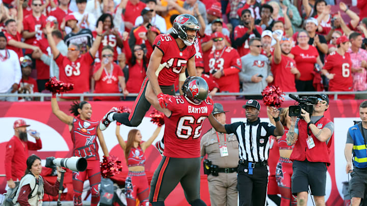 Dec 8, 2024; Tampa, Florida, USA; Tampa Bay Buccaneers wide receiver Jalen McMillan (15) celebrates with center Graham Barton (62) after he scored a touchdown  against the Las Vegas Raiders during the second half at Raymond James Stadium. Mandatory Credit: Kim Klement Neitzel-Imagn Images
