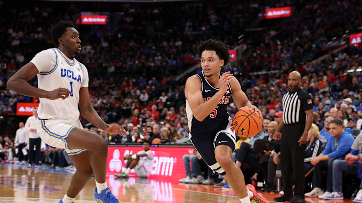 Nov 14, 2025; Inglewood, California, USA; Arizona Wildcats guard Brayden Burries (5) drives to the basket against UCLA Bruins center Xavier Booker (1) during the first half of the Hall of Fame Series game at Intuit Dome. Mandatory Credit: Kiyoshi Mio-Imagn Images Nov 14, 2025; Inglewood, California, USA; Arizona Wildcats guard Brayden Burries (5) drives to the basket against UCLA Bruins center Xavier Booker (1) during the first half of the Hall of Fame Series game at Intuit Dome. Mandatory Credit: Kiyoshi Mio-Imagn Images