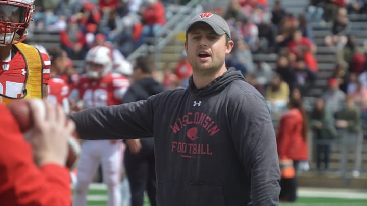 Wisconsin safeties coach Jack Cooper runs Badgers through position drills during the program's April 19 spring showcase scrimmage.
