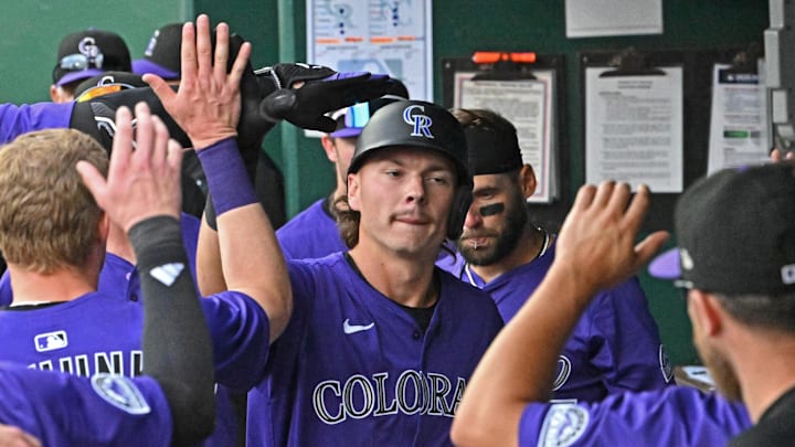 Apr 24, 2025; Kansas City, Missouri, USA;  Colorado Rockies left fielder Jordan Beck (27) celebrates in the dugout after hitting a solo homerun in the eighth inning against the Kansas City Royals at Kauffman Stadium. Mandatory Credit: Peter Aiken-Imagn Images