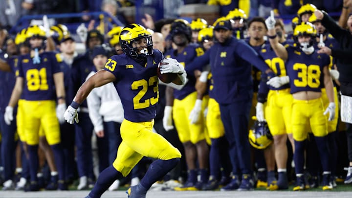 Nov 23, 2024; Ann Arbor, Michigan, USA;  Michigan Wolverines running back Jordan Marshall (23) runs the ball on a kick off return in the second half against the Northwestern Wildcats at Michigan Stadium. Mandatory Credit: Rick Osentoski-Imagn Images