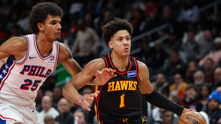 Dec 14, 2025; Atlanta, Georgia, USA; Atlanta Hawks forward Jalen Johnson (1) drives the ball towards the basket against Philadelphia 76ers forward Dominick Barlow (25) during the fourth quarter at State Farm Arena. Mandatory Credit: Jordan Godfree-Imagn Images