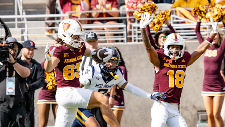 Arizona State Sun Devils Derek Eusebio (83) jumps to score a touchdown against the West Virginia Mountaineers during a game at Mountain America Stadium in Tempe on Nov. 15, 2025.