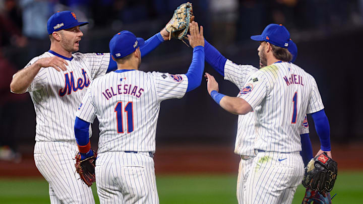 Oct 18, 2024; New York City, New York, USA; New York Mets first baseman Pete Alonso (20) and second baseman Jose Iglesias (11) and second baseman Jeff McNeil (1) and right fielder Tyrone Taylor (15) celebrates after the Mets defatted the Los Angeles Dodgers in game five of the NLCS for the 2024 MLB playoffs at Citi Field. Mandatory Credit: Vincent Carchietta-Imagn Images Oct 18, 2024; New York City, New York, USA; New York Mets first baseman Pete Alonso (20) and second baseman Jose Iglesias (11) and second baseman Jeff McNeil (1) and right fielder Tyrone Taylor (15) celebrates after the Mets defatted the Los Angeles Dodgers in game five of the NLCS for the 2024 MLB playoffs at Citi Field. Mandatory Credit: Vincent Carchietta-Imagn Images