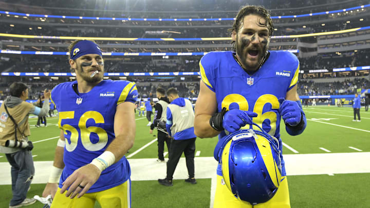 Dec 28, 2024; Inglewood, California, USA;  Los Angeles Rams linebacker Christian Rozeboom (56) and tight end Colby Parkinson (86) wave to fans as they leave the field after defeating the Arizona Cardinals at SoFi Stadium. Mandatory Credit: Jayne Kamin-Oncea-Imagn Images