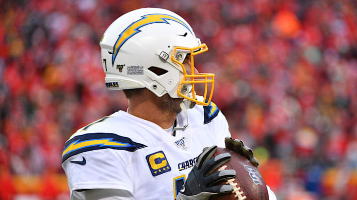 Dec 29, 2019; Kansas City, Missouri, USA; Los Angeles Chargers quarterback Philip Rivers (17) warms up on the sidelines during the game against the Kansas City Chiefs at Arrowhead Stadium. Mandatory Credit: Denny Medley-Imagn Images