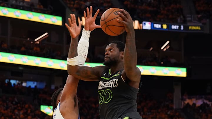 May 10, 2025; San Francisco, California, USA; Minnesota Timberwolves forward-center Julius Randle (30) drives to the basket against Golden State Warriors forward Kevon Looney (5) in the third quarter during game three in the second round of the 2025 NBA Playoffs at Chase Center. Mandatory Credit: David Gonzales-Imagn Images