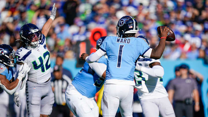Tennessee Titans quarterback Cam Ward (1) is under pressure during the second quarter against the Seattle Seahawks at Nissan Stadium in Nashville, Tenn., Sunday, Nov. 23, 2025.