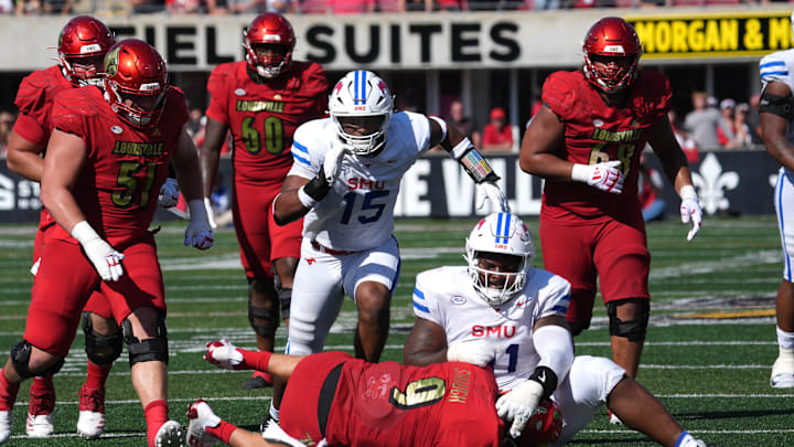 Louisville’sTyler Shoughis sacked by SMU’s Jayden Milliner-Jones this Saturday.
Oct. 5, 2024