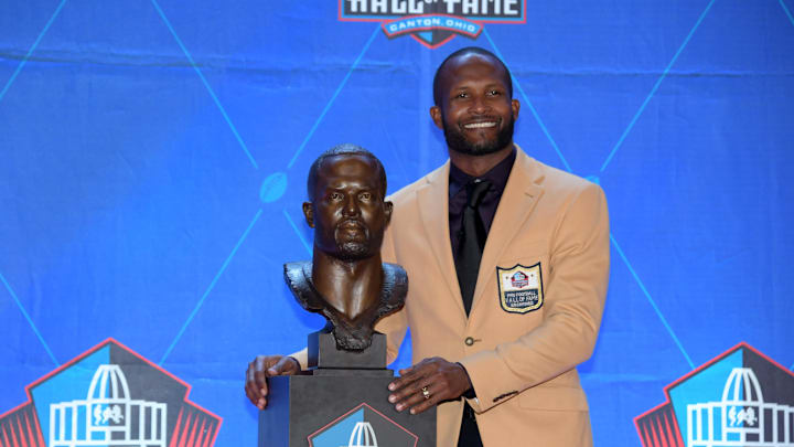 Aug 3, 2019; Canton, OH, USA; Champ Bailey poses with bust during the Pro Football Hall of Fame Enshrinement at Tom Benson Hall of Fame Stadium. Mandatory Credit: Kirby Lee-Imagn Images Aug 3, 2019; Canton, OH, USA; Champ Bailey poses with bust during the Pro Football Hall of Fame Enshrinement at Tom Benson Hall of Fame Stadium. Mandatory Credit: Kirby Lee-Imagn Images
