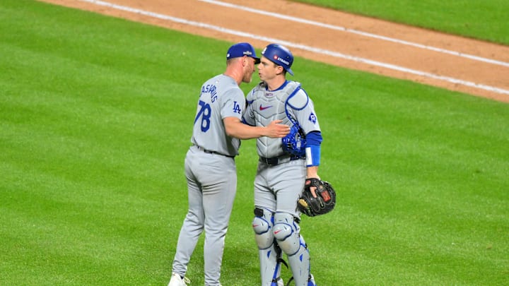 Oct 16, 2024; New York City, New York, USA; Los Angeles Dodgers pitcher Ben Casparius (78) reacts with catcher Austin Barnes (15) against the New York Mets after the ninth inning during game three of the NLCS for the 2024 MLB playoffs at Citi Field. Mandatory Credit: John Jones-Imagn Images Oct 16, 2024; New York City, New York, USA; Los Angeles Dodgers pitcher Ben Casparius (78) reacts with catcher Austin Barnes (15) against the New York Mets after the ninth inning during game three of the NLCS for the 2024 MLB playoffs at Citi Field. Mandatory Credit: John Jones-Imagn Images