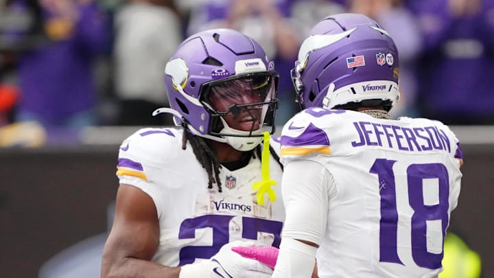 Oct 5, 2025; Tottenham, United Kingdom; Minnesota Vikings running back Jordan Mason (27) celebrates with wide receiver Justin Jefferson (18) after scoring a touchdown against the Cleveland Browns during the third quarter of an NFL International Series game at Tottenham Hotspur Stadium. Mandatory Credit: Kirby Lee-Imagn Images Oct 5, 2025; Tottenham, United Kingdom; Minnesota Vikings running back Jordan Mason (27) celebrates with wide receiver Justin Jefferson (18) after scoring a touchdown against the Cleveland Browns during the third quarter of an NFL International Series game at Tottenham Hotspur Stadium. Mandatory Credit: Kirby Lee-Imagn Images