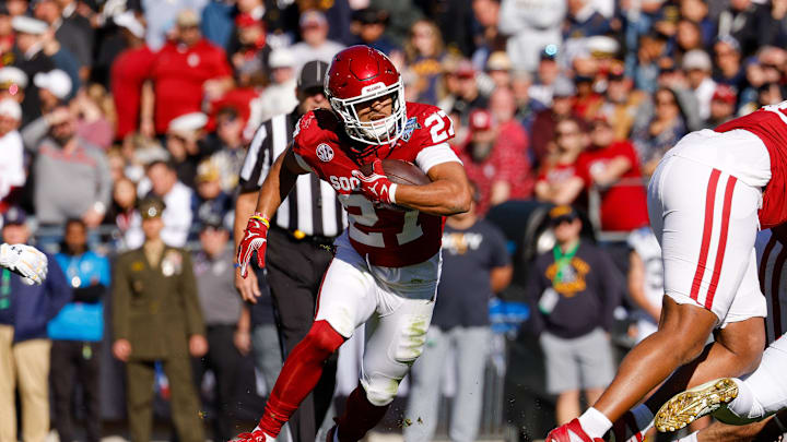 Dec 27, 2024; Fort Worth, TX, USA; Oklahoma Sooners running back Gavin Sawchuk (27) runs with the ball during the first quarter against the Navy Midshipmen at Amon G. Carter Stadium. Mandatory Credit: Andrew Dieb-Imagn Images