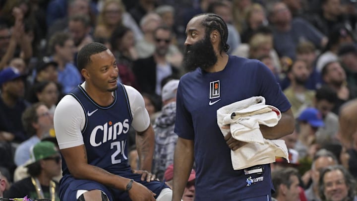 Mar 1, 2024; Los Angeles, California, USA;  Los Angeles Clippers guard Norman Powell (24) talks with guard James Harden (1) on the bench in the second half against the Washington Wizards at Crypto.com Arena. Mandatory Credit: Jayne Kamin-Oncea-Imagn Images