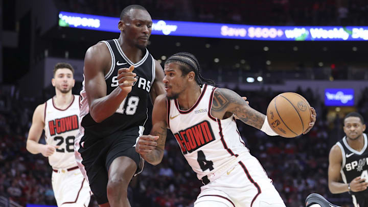 Feb 26, 2025; Houston, Texas, USA; Houston Rockets guard Jalen Green (4) drives with the ball as San Antonio Spurs center Bismack Biyombo (18) defends during the third quarter at Toyota Center. Mandatory Credit: Troy Taormina-Imagn Images Feb 26, 2025; Houston, Texas, USA; Houston Rockets guard Jalen Green (4) drives with the ball as San Antonio Spurs center Bismack Biyombo (18) defends during the third quarter at Toyota Center. Mandatory Credit: Troy Taormina-Imagn Images