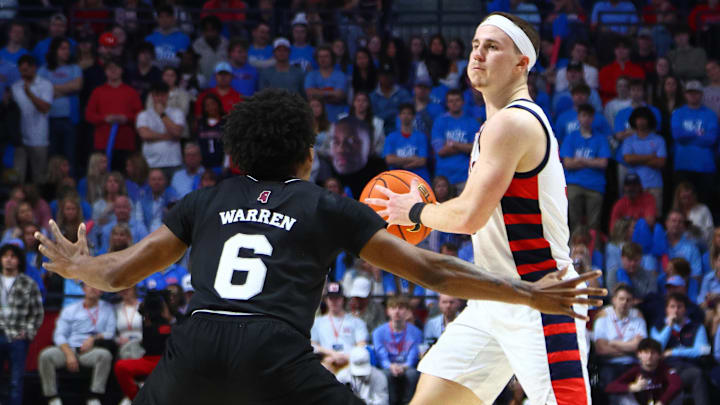 Feb 15, 2025; Oxford, Mississippi, USA; Mississippi Rebels guard Sean Pedulla (3) handles the ball as Mississippi State Bulldogs guard Dellquan Warren (6) defends during the second half at The Sandy and John Black Pavilion at Ole Miss. Mandatory Credit: Petre Thomas-Imagn Images