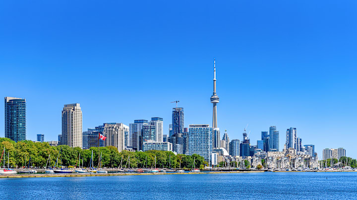 Cityscape and downtown district on a clear blue sky day,...