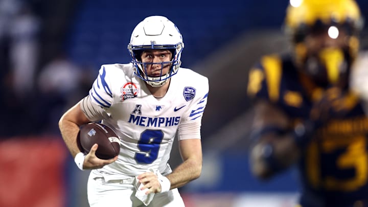 Memphis Tigers quarterback Seth Henigan (9) runs the ball against the West Virginia Mountaineers in the first quarter at Toyota Stadium. Mandatory Credit: Tim Heitman-Imagn Images