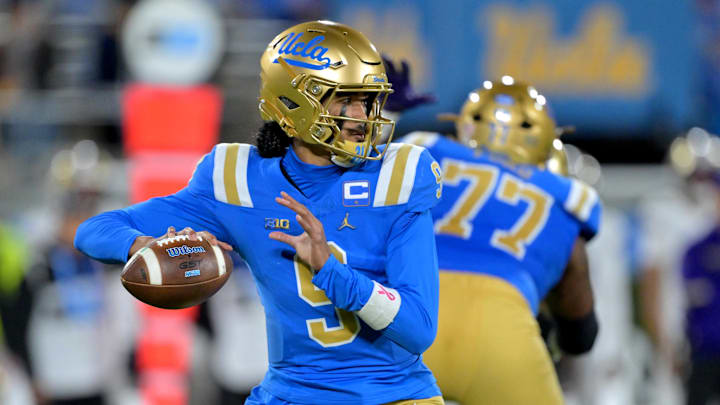 Nov 22, 2025; Pasadena, California, USA;  UCLA Bruins quarterback Nico Iamaleava (9) sets to pass the ball during the first half against the Washington Huskies at the Rose Bowl. Mandatory Credit: Jayne Kamin-Oncea-Imagn Images