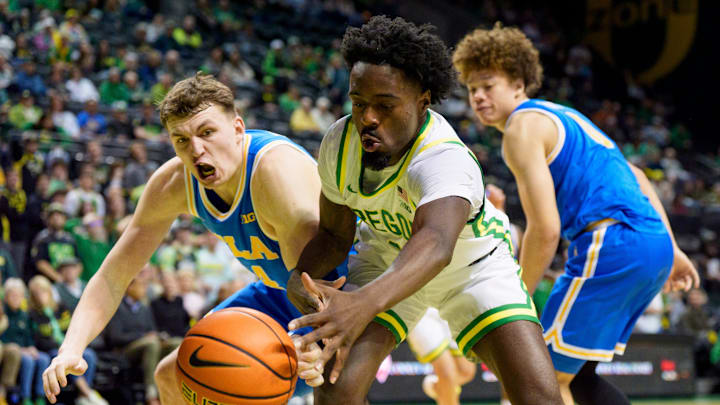 Oregon forward Dezdrick Lindsay, right, and UCLA forward Tyler Bilodeau dive after the ball as the Oregon Ducks host the UCLA Bruins on Jan. 28, 2026, at Matthew Knight Arena in Eugene, Oregon. Oregon forward Dezdrick Lindsay, right, and UCLA forward Tyler Bilodeau dive after the ball as the Oregon Ducks host the UCLA Bruins on Jan. 28, 2026, at Matthew Knight Arena in Eugene, Oregon.
