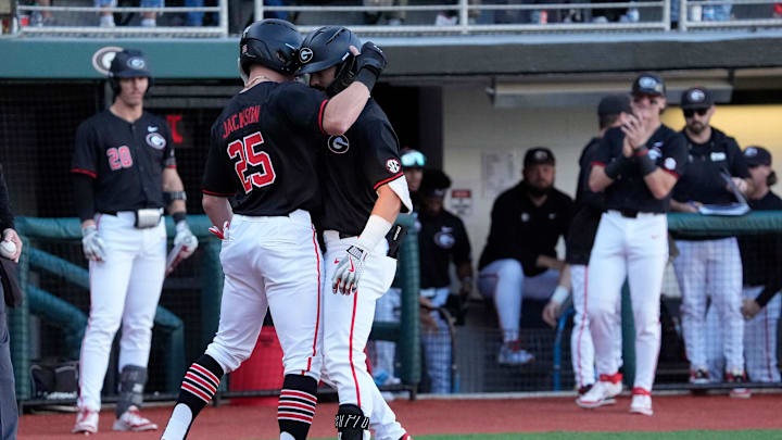 Georgia infielder Kolby Branch (9) celebrates with Georgia catcher Daniel Jackson (25) after hitting a home run during a NCAA baseball game against Arkansas in Athens, Ga., on Friday, April 11, 2025.