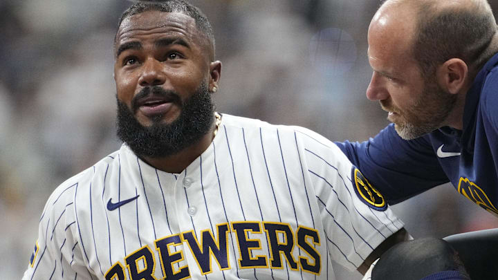 May 9, 2026; Milwaukee, Wisconsin, USA; Milwaukee Brewers third baseman Luis Rengifo (13) goes down with an injury after sliding into third base against the New York Yankees in the tenth inning at American Family Field. Mandatory Credit: Michael McLoone-Imagn Images