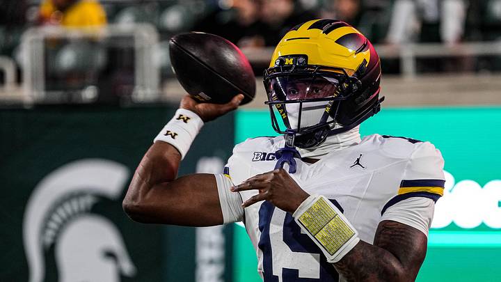 Michigan quarterback Bryce Underwood (19) warms up at Spartan Stadium in East Lansing on Saturday, October 25, 2025. Michigan quarterback Bryce Underwood (19) warms up at Spartan Stadium in East Lansing on Saturday, October 25, 2025.
