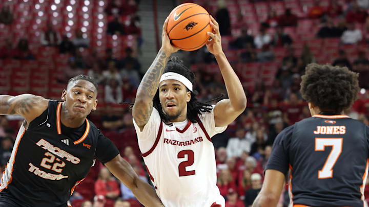 Nov 18, 2024; Fayetteville, Arkansas, USA; Arkansas Razorbacks guard Boogie Fland (2) drives against Pacific Tigers guard Elijah Fisher (22) during the second half at Bud Walton Arena. Arkansas won 91-72. Mandatory Credit: Nelson Chenault-Imagn Images