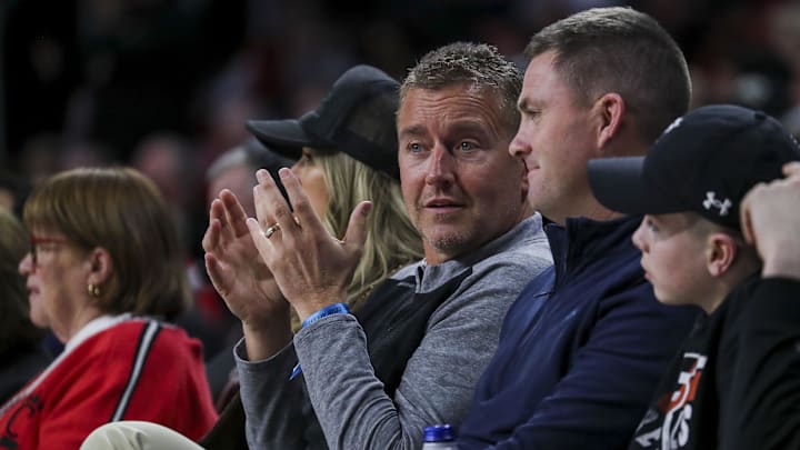 Feb 13, 2024; Cincinnati, Ohio, USA; ESPN commentator Kirk Herbstreit talks with Cincinnati Bengals head coach Zac Taylor during the first half in the game between the Iowa State Cyclones and the Cincinnati Bearcats at Fifth Third Arena. Mandatory Credit: Katie Stratman-USA TODAY Sports