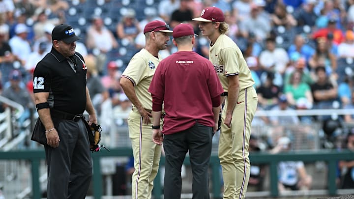 Jun 18, 2024; Omaha, NE, USA; Florida State Seminoles starting pitcher Andrew Armstrong (37) meets with head coach Link Jarrett to discuss an apparent injury during the second inning against the North Carolina Tar Heels at Charles Schwab Field Omaha. Mandatory Credit: Steven Branscombe-Imagn Images Jun 18, 2024; Omaha, NE, USA; Florida State Seminoles starting pitcher Andrew Armstrong (37) meets with head coach Link Jarrett to discuss an apparent injury during the second inning against the North Carolina Tar Heels at Charles Schwab Field Omaha. Mandatory Credit: Steven Branscombe-Imagn Images