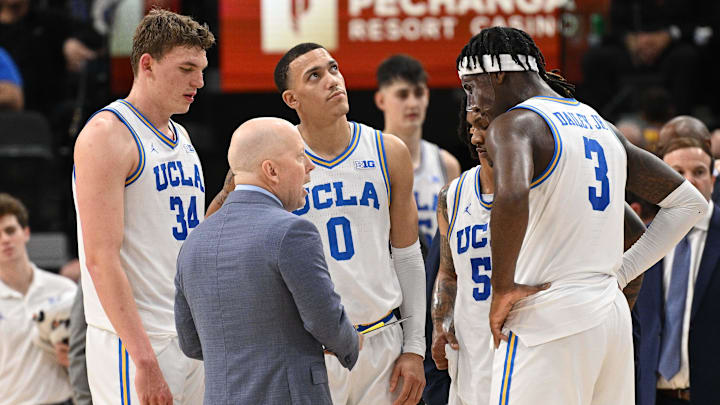 Dec 28, 2024; Inglewood, California, USA; UCLA Bruins head coach Mick Cronin talks to Tyler Bilodeau (34), Kobe Johnson (0), Dylan Andrews (2) and Eric Dailey Jr. (3) in the first half against the Gonzaga Bulldogs during a college basketball game at Intuit Dome. Mandatory Credit: Robert Hanashiro-Imagn Images