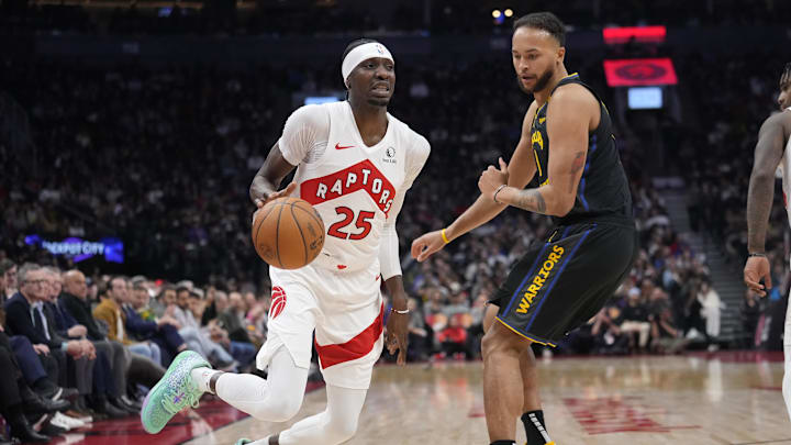 Jan 13, 2025; Toronto, Ontario, CAN; Toronto Raptors forward Chris Boucher (25) dribbles around Golden State Warriors forward Kyle Anderson (1) during the first half at Scotiabank Arena. Mandatory Credit: John E. Sokolowski-Imagn Images