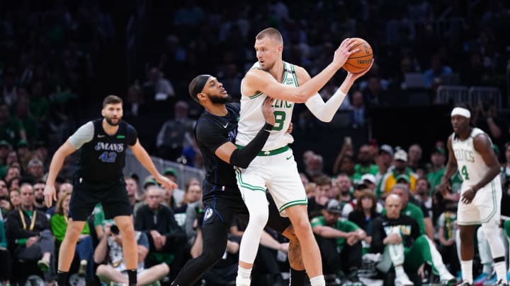 Jun 6, 2024; Boston, Massachusetts, USA; Boston Celtics center Kristaps Porzingis (8) controls the ball against Dallas Mavericks center Daniel Gafford (21) in the first quarter during game one of the 2024 NBA Finals at TD Garden. Mandatory Credit: David Butler II-USA TODAY Sports Jun 6, 2024; Boston, Massachusetts, USA; Boston Celtics center Kristaps Porzingis (8) controls the ball against Dallas Mavericks center Daniel Gafford (21) in the first quarter during game one of the 2024 NBA Finals at TD Garden. Mandatory Credit: David Butler II-USA TODAY Sports