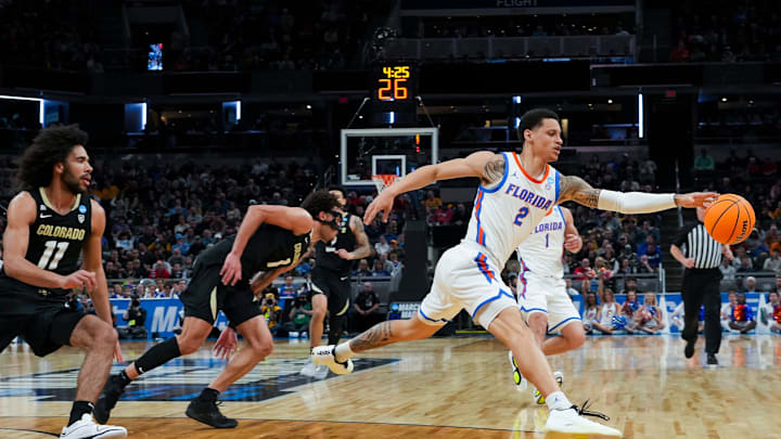 Florida Gators guard Riley Kugel (2) runs after a loose ball against the Colorado Buffaloes on