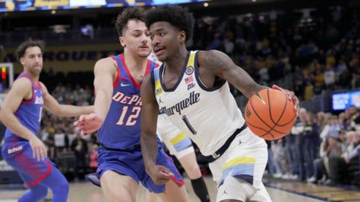 Marquette guard Kam Jones (1) drive pasty DePaul guard Jacob Meyer (12) during the first half of their game Tuesday, Feb. 11, 2025, at Fiserv Forum in Milwaukee, Wisconsin. Marquette guard Kam Jones (1) drive pasty DePaul guard Jacob Meyer (12) during the first half of their game Tuesday, Feb. 11, 2025, at Fiserv Forum in Milwaukee, Wisconsin.