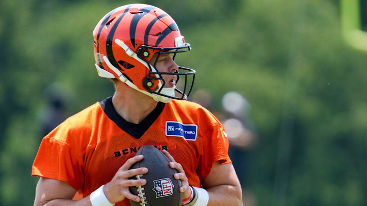 Cincinnati Bengals quarterback Joe Burrow (9) drops back during a session of organized team activities on the Bengals practice field at Paycor Stadium in downtown Cincinnati on Tuesday, June 3, 2025.