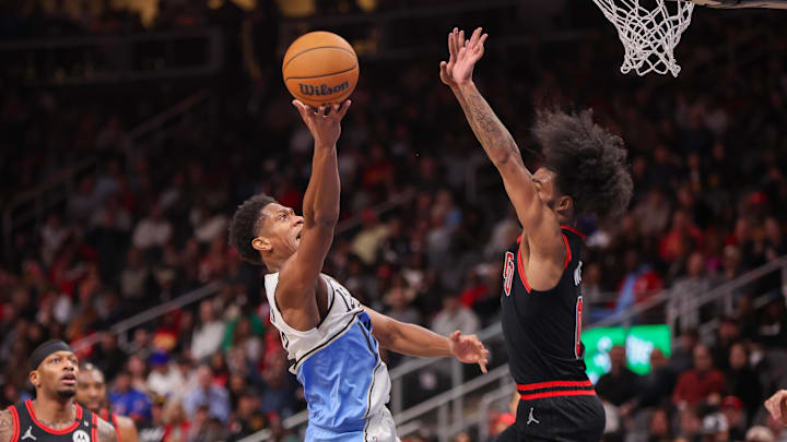 Dec 26, 2024; Atlanta, Georgia, USA; Atlanta Hawks forward De'Andre Hunter (12) shoots past Chicago Bulls guard Coby White (0) in the second quarter at State Farm Arena. Mandatory Credit: Brett Davis-Imagn Images Dec 26, 2024; Atlanta, Georgia, USA; Atlanta Hawks forward De'Andre Hunter (12) shoots past Chicago Bulls guard Coby White (0) in the second quarter at State Farm Arena. Mandatory Credit: Brett Davis-Imagn Images