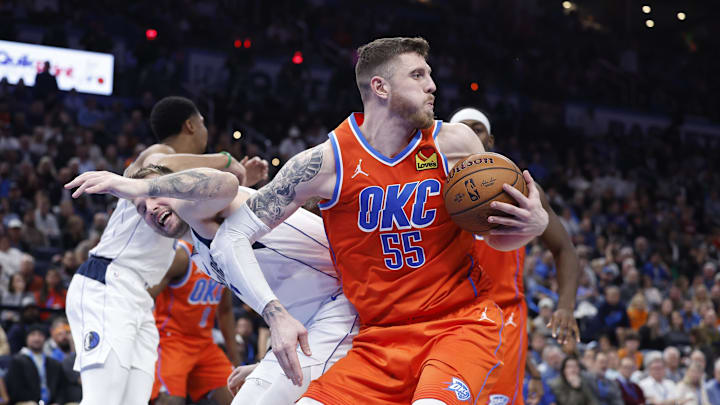 Dec 10, 2024; Oklahoma City, Oklahoma, USA; Oklahoma City Thunder center Isaiah Hartenstein (55) steals the ball away from Dallas Mavericks guard Luka Doncic (77) during the second half at Paycom Center. Mandatory Credit: Alonzo Adams-Imagn Images