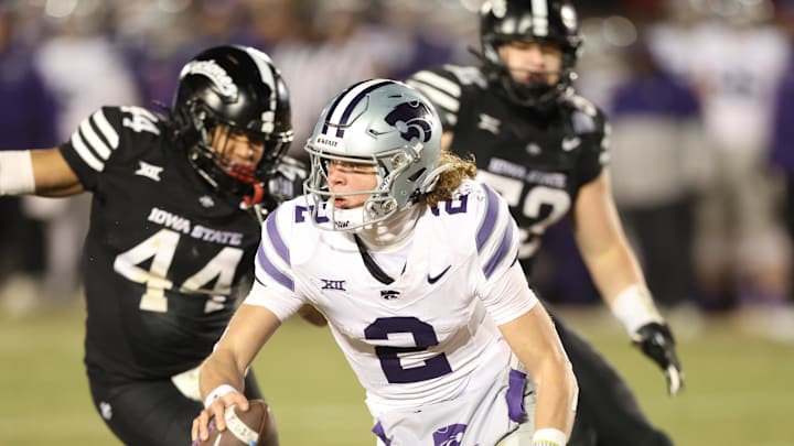 Nov 30, 2024; Ames, Iowa, USA;  Kansas State Wildcats quarterback Avery Johnson (2) is pressured by Iowa State Cyclones linebacker Jacob Ellis (44)  in the fourth quarter at Jack Trice Stadium. Mandatory Credit: Reese Strickland-Imagn Images