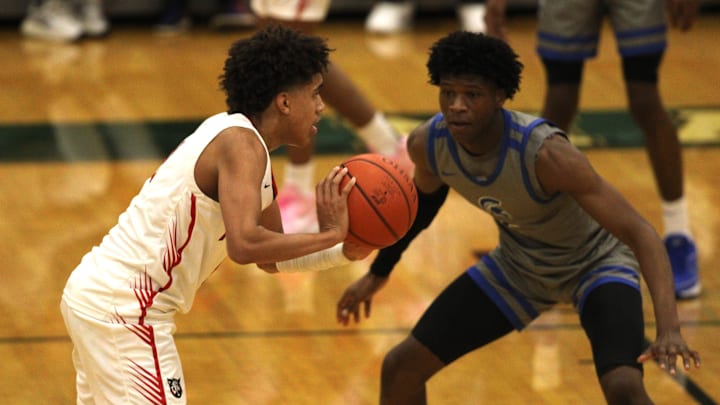 Newport sophomore Taylen Kinney passes the ball during the Ohio Valley Hoops Classic Dec. 1, 2023 at Mason's high school gymnasium.
