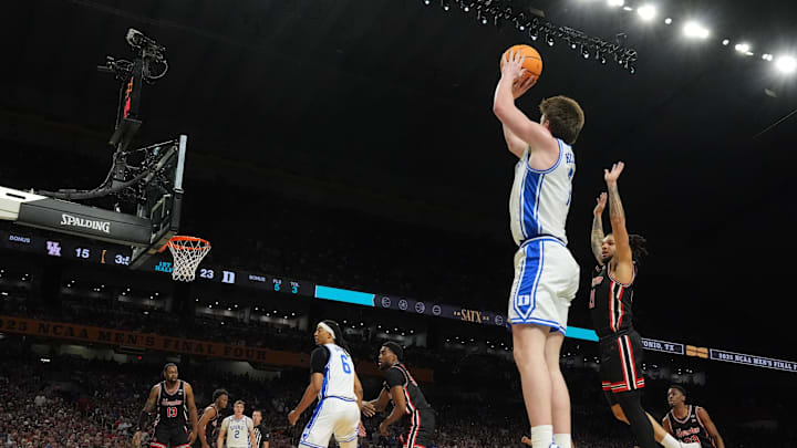 Apr 5, 2025; San Antonio, TX, USA; Duke Blue Devils guard Kon Knueppel (7) shoots against Houston Cougars guard Emanuel Sharp (21) in the semifinals of the men's Final Four of the 2025 NCAA Tournament at the Alamodome. Mandatory Credit: Robert Deutsch-Imagn Images