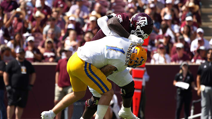 Sep 7, 2024; College Station, Texas, USA; Texas A&M Aggies offensive lineman Ar'maj Reed-Adams (55) blocks McNeese State linebacker Tristan Driggers during the first quarter at Kyle Field. Mandatory Credit: Dustin Safranek-Imagn Images
