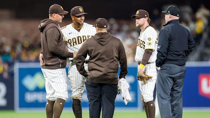 Mar 27, 2026; San Diego, California, USA; San Diego Padres manager Craig Stammen (14) looks at shortstop Xander Bogaerts (2) during sixth inning against the Detroit Tigers at Petco Park. Mandatory Credit: David Frerker-Imagn Images