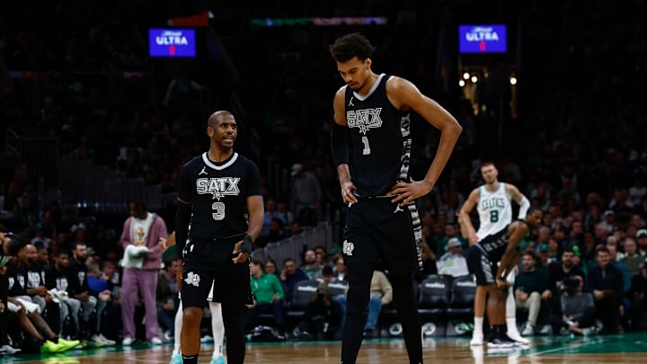 Spurs' Chris Paul (left) and Victor Wembanyama (right) pictured versus Boston Celtics