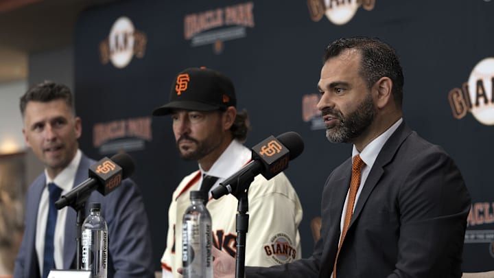Oct 30, 2025; San Francisco, CA, USA;  San Francisco Giants general manager Zack Minasian (right) speaks at a press conference to introduce new manager Tony Vitello (center) at Oracle Park. Mandatory Credit: D. Ross Cameron-Imagn Images