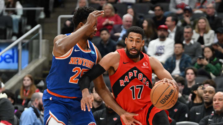 Mar 27, 2024; Toronto, Ontario, CAN;  Toronto Raptors guard Garrett Temple (17) dribbles the ball past New York Knicks forward Mamadi Diakite (25) in the second half at Scotiabank Arena. 
