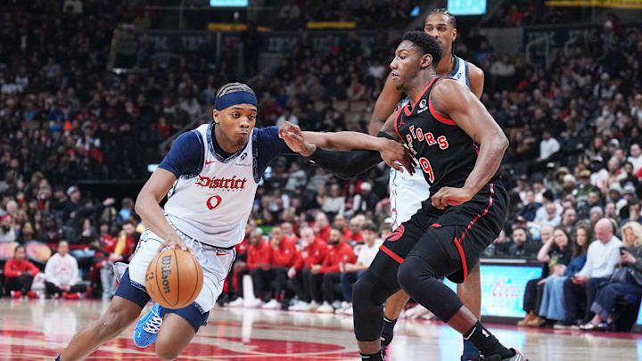 Mar 8, 2025; Toronto, Ontario, CAN; Washington Wizards guard Bilal Coulibaly (0) controls the ball as Toronto Raptors guard RJ Barrett (9) tries to defend during the first quarter at Scotiabank Arena. Mandatory Credit: Nick Turchiaro-Imagn Images Mar 8, 2025; Toronto, Ontario, CAN; Washington Wizards guard Bilal Coulibaly (0) controls the ball as Toronto Raptors guard RJ Barrett (9) tries to defend during the first quarter at Scotiabank Arena. Mandatory Credit: Nick Turchiaro-Imagn Images